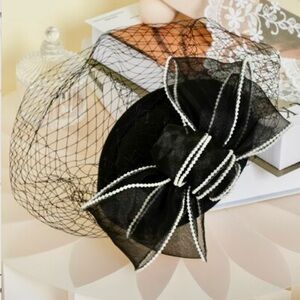 Elegant Black Fascinator with Bow and Veil